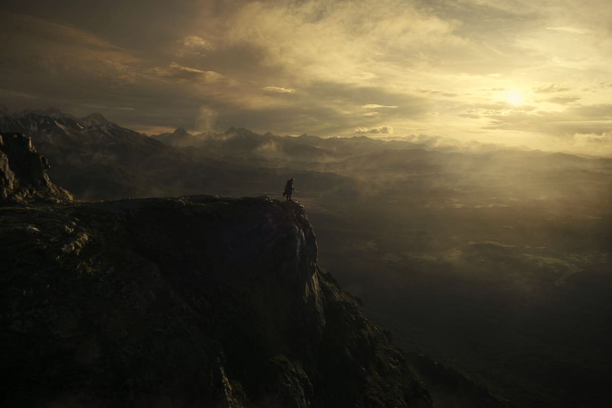 Epic fantasy landscape, a lone armored warrior on a cliff overlooking a misty valley at sunrise, cinematic concept art